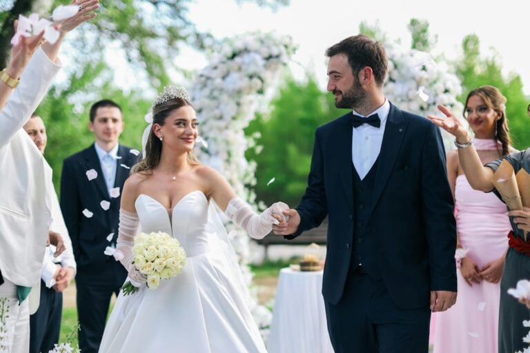 Bride and groom exchanging vows during outdoor wedding ceremony.
