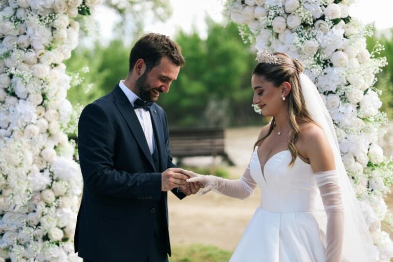 Bride and groom exchanging rings during their wedding ceremony.