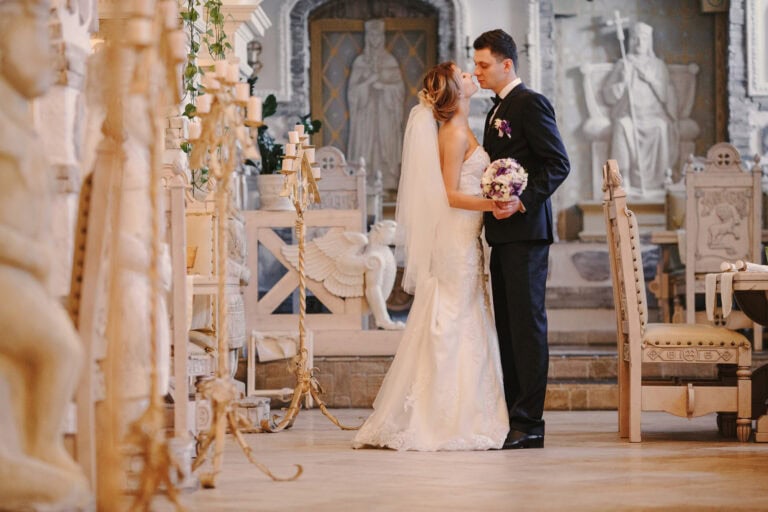 Bride and groom sharing a romantic moment during their wedding ceremony.